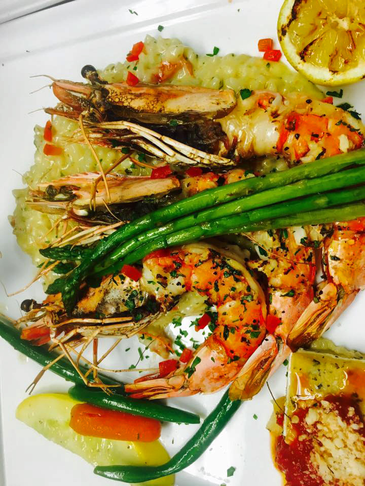 Gambas : U2 Mediterranean Shrimp, grilled with garlic and herbs , lemon risotto ,asparagus and roasted garlic pepper sauce