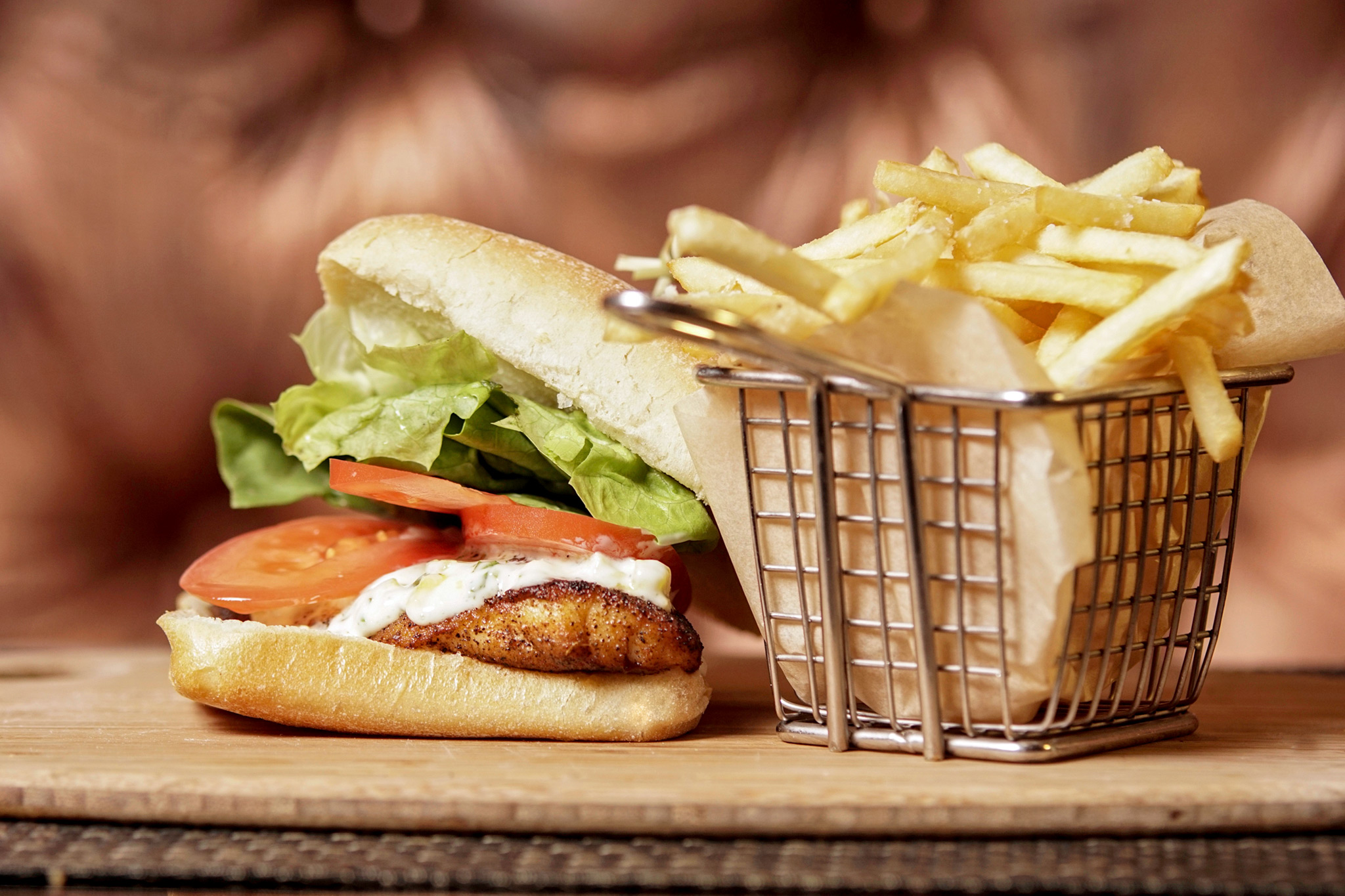 Grouper Sandwich - blackened gulf grouper, bibb lettuce, plum tomato, pickled pineapple tartar sauce