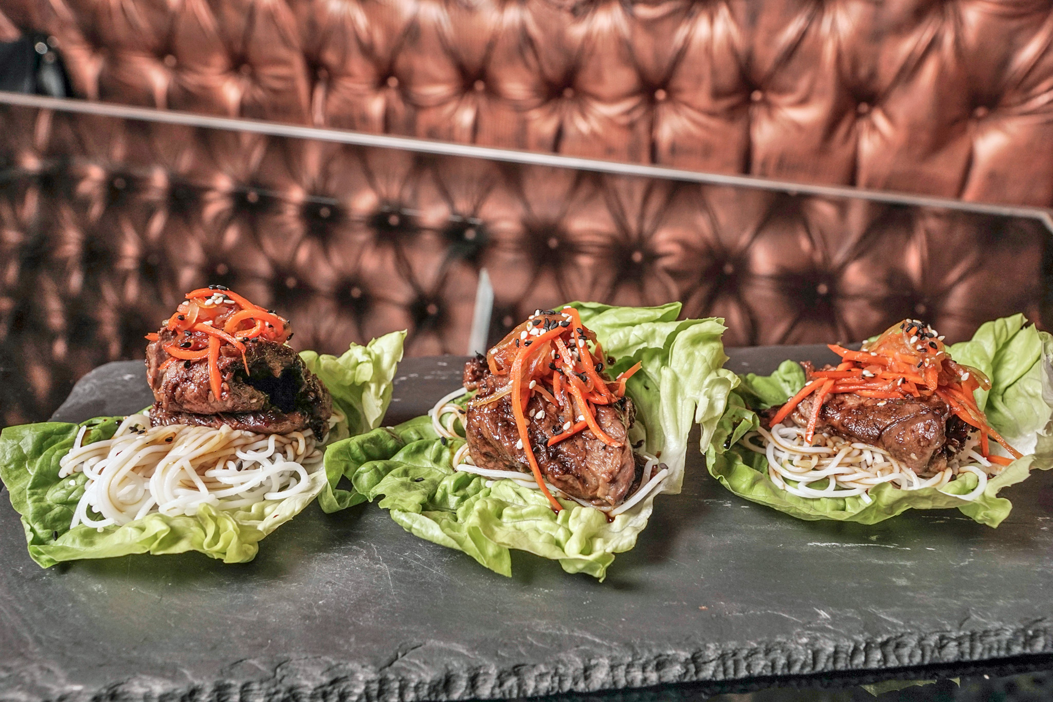 Korean Beef Bulgogi - marinated grilled beef, bibb lettuce, rice vermicelli, daikon & carrot slaw, k sauce