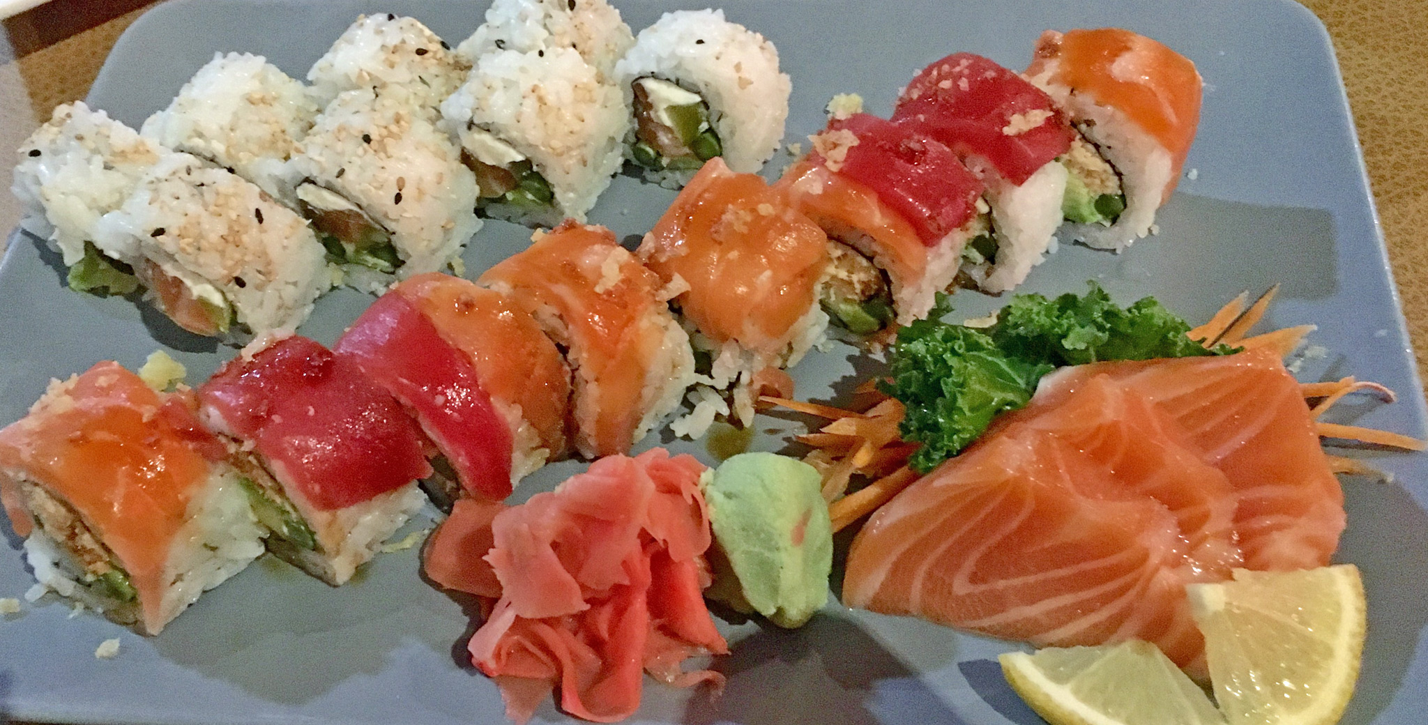 Top: THE DTSP - Salmon, pickle, cream cheese, avocado and asparagus. Middle: BOMB ‘CHEL - Snow crab, avocado and asparagus roll topped with salmon, tuna, eel sauce, wasabi mayo and tempura chips. Bottom: Salmon Sashimi