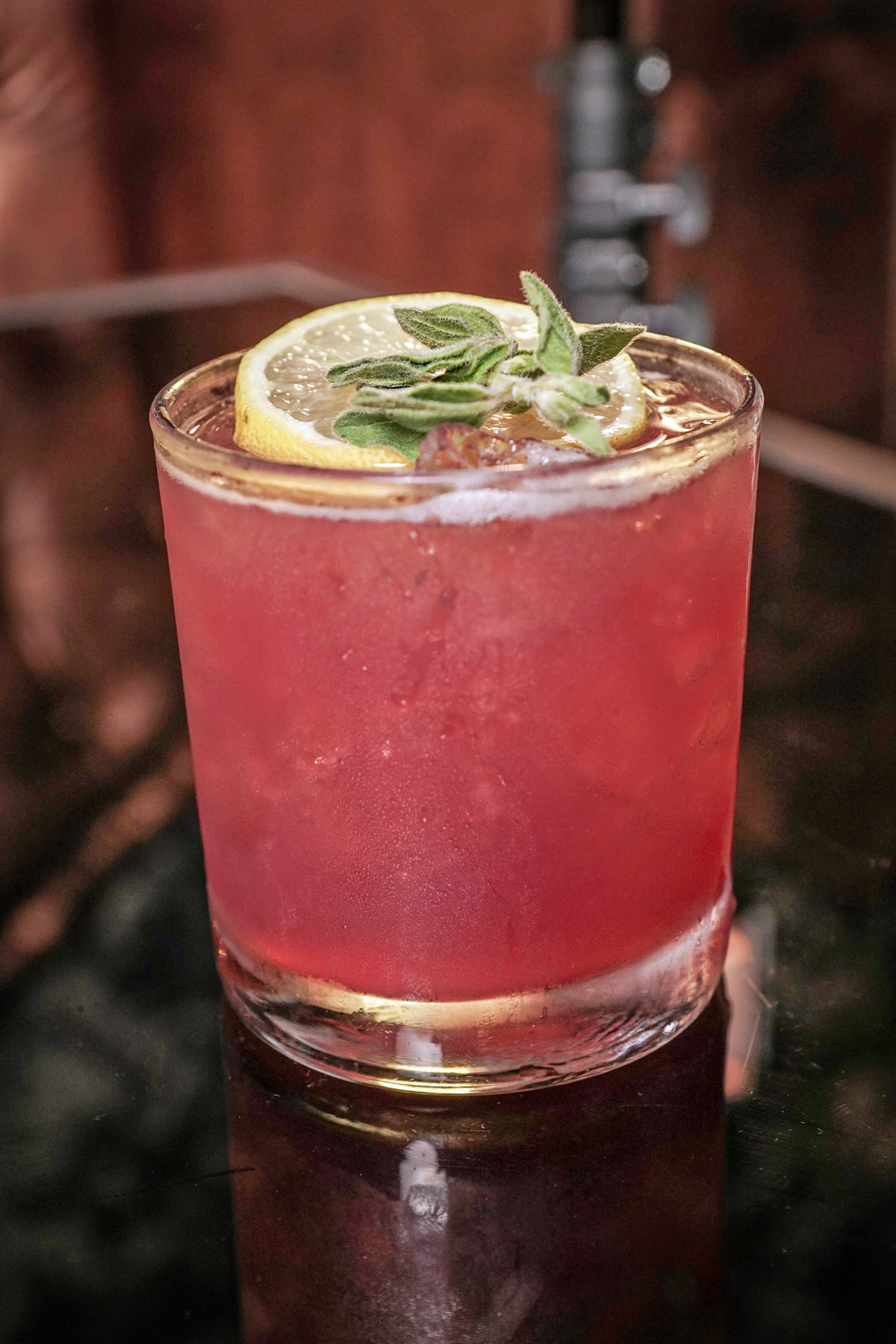 Secret Garden - grey goose vodka, mathilde cassis black currant liqueur, fresh lemon sour & sage leaves garnished with a lemon wheel & sage leaf