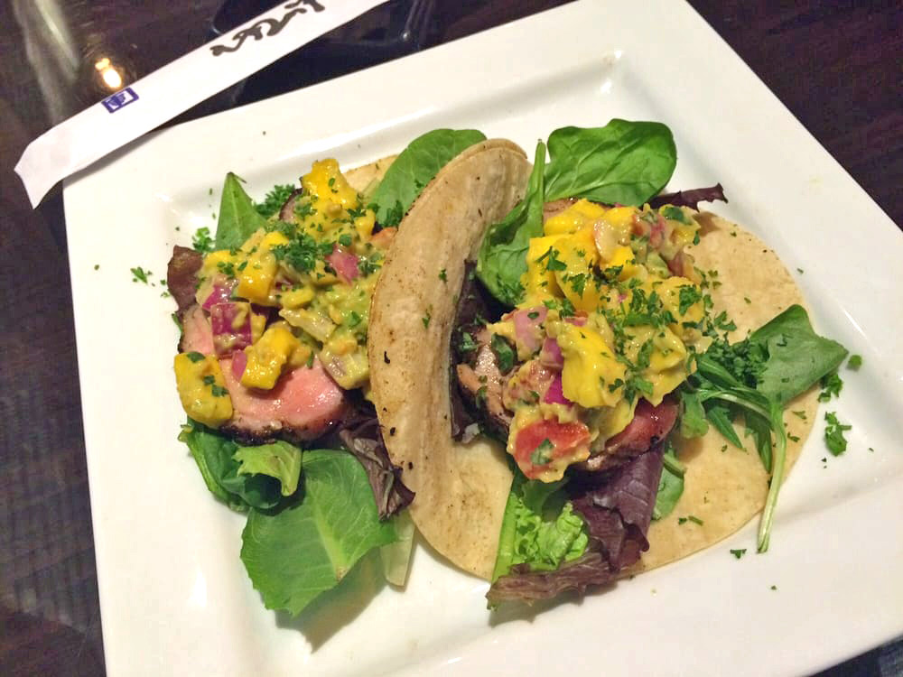 THE DONALD - Sliced, spiced and pan seared duck breast topped with mixed field greens, mango cilantro salsa fresca and ginger dressing