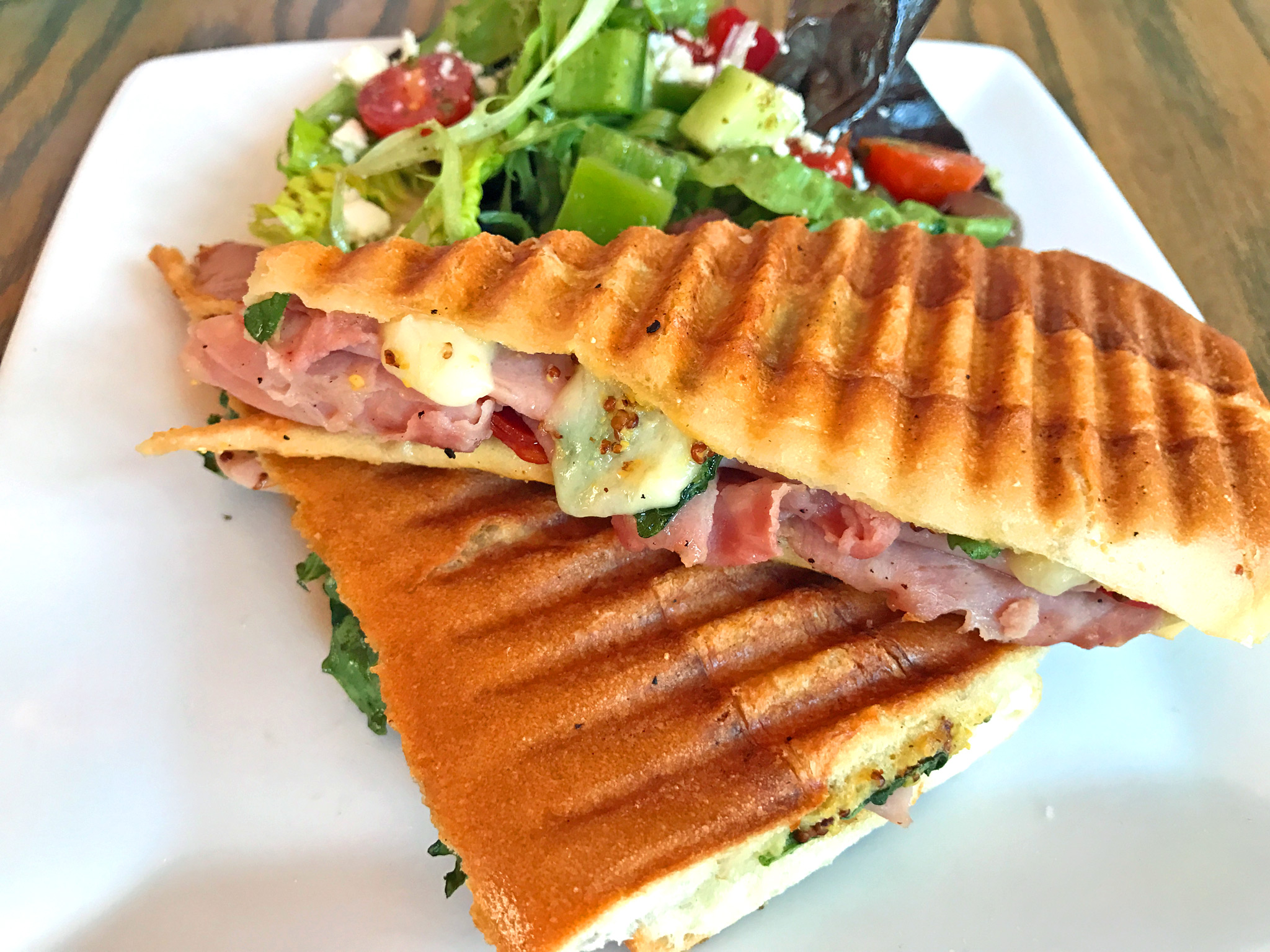 Bikini Sandwich (lunch menu only) Ham, chorizo, manchego, fig mustard jam, pickled serranos, and arugula