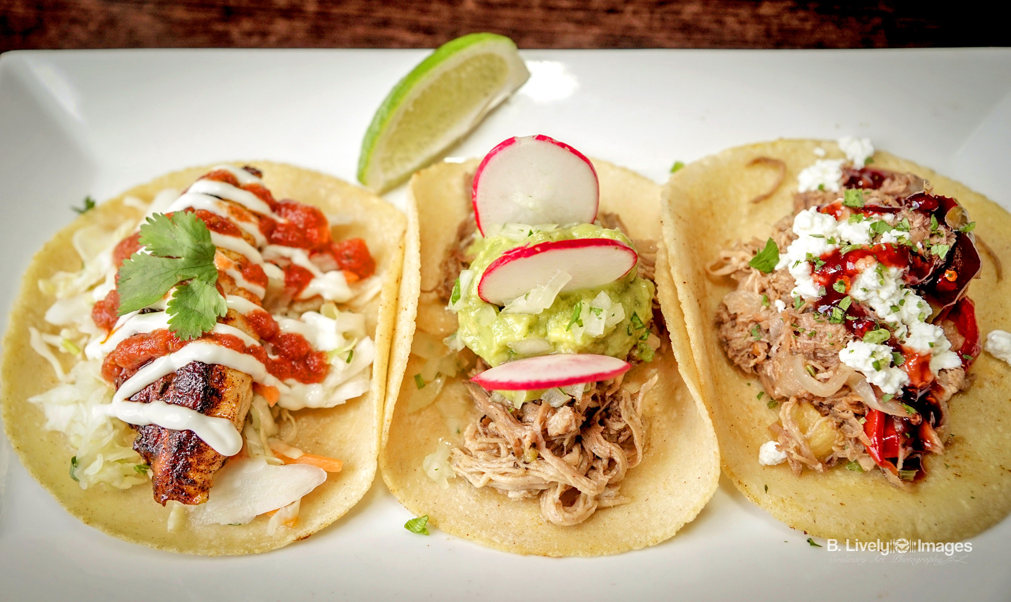 Tacos - Baja Fish - Grilled fresh fish, salsa roja, Mexican slaw and lime crema. Pulled Pork - Shredded roast pork, guacamole, cilantro onion and radish. Duck - Orange braised duck confit, grilled pineapple, goat cheese, cilantro and red chile jelly