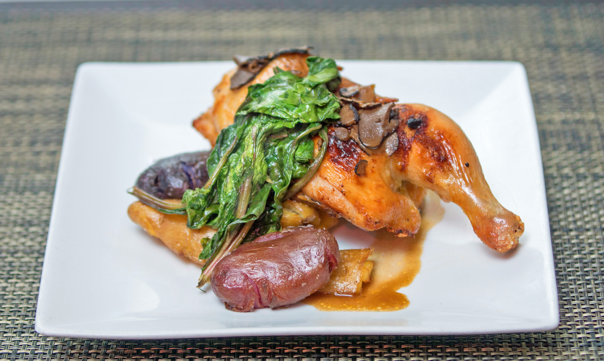 Butter and Thyme Roasted ½ Chicken - crispy fingerlings, sauté greens, truffle au jus