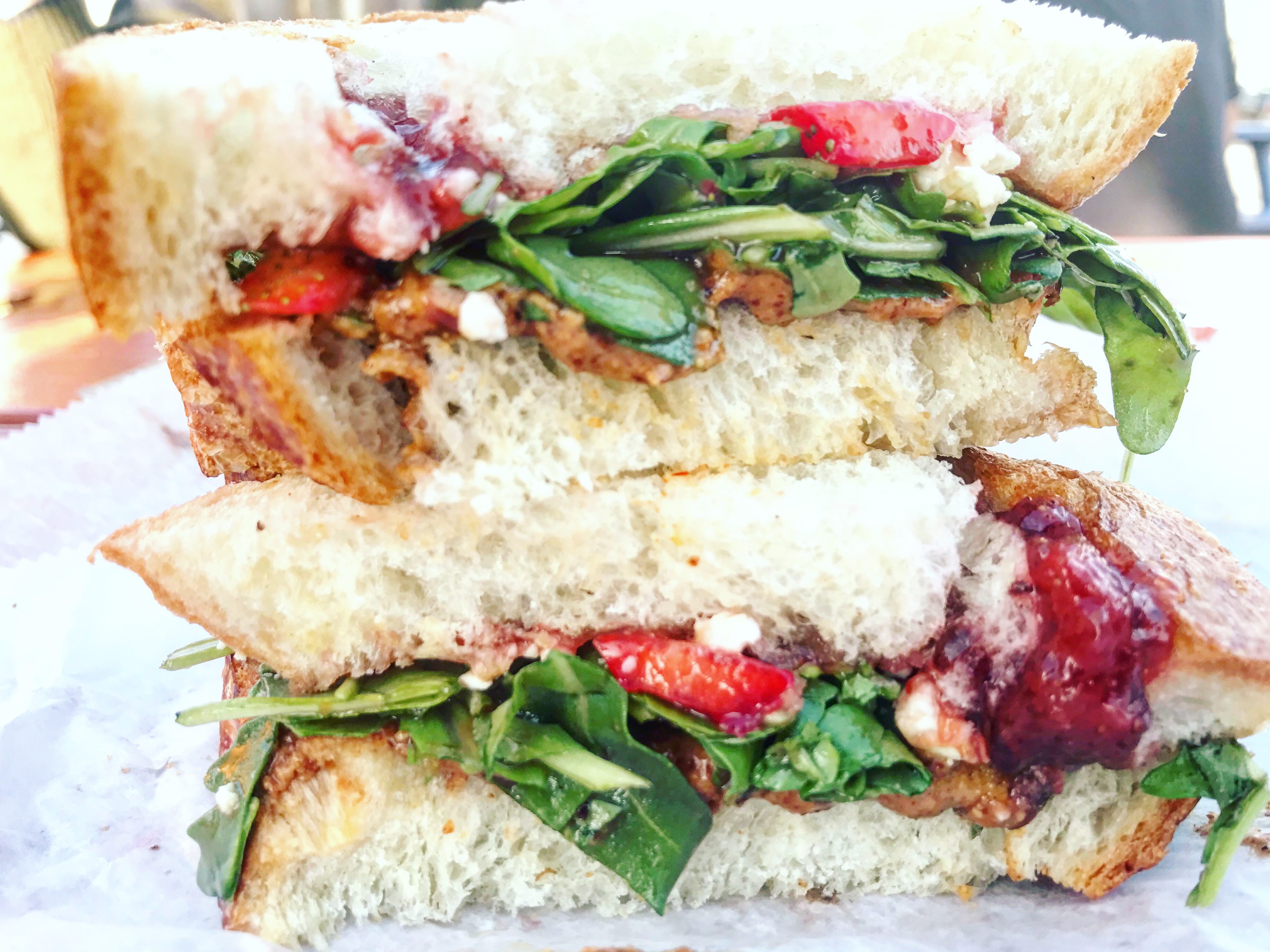 Strawberry Fields, a Current Special: Strawberry Preserves, Almond Nut Butter, BLaby Arugula, Dijon Vinaigrette, Feta Cheese and Sliced Strawberries