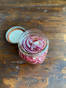 Jar of picked red onions