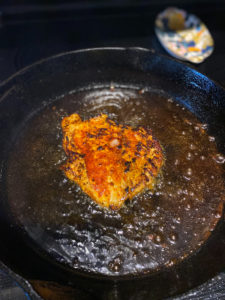 Chicken cooking in the oil