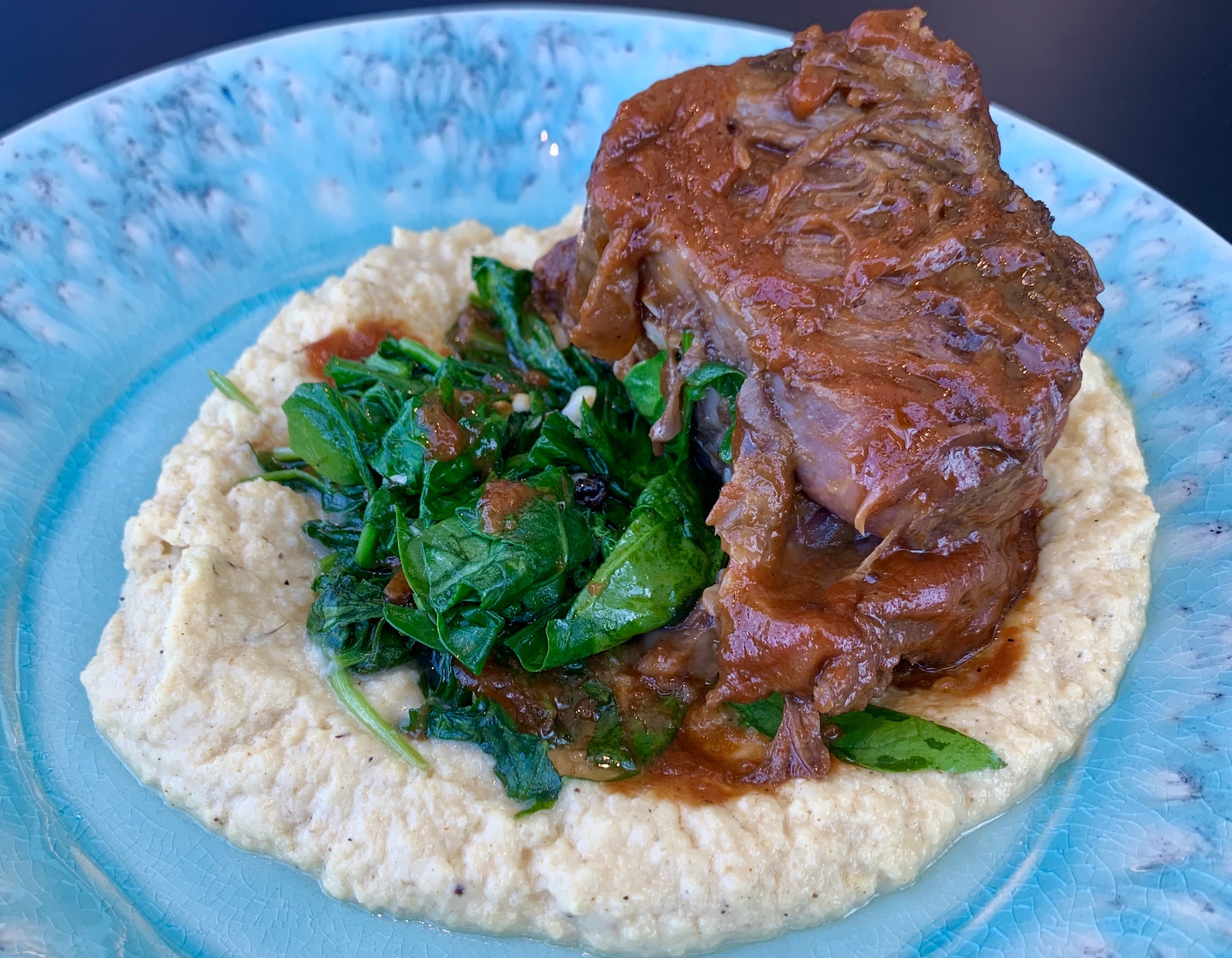 Short Rib with a ginger guava BBQ sauce, roasted cauliflower mash and garlic kale.
