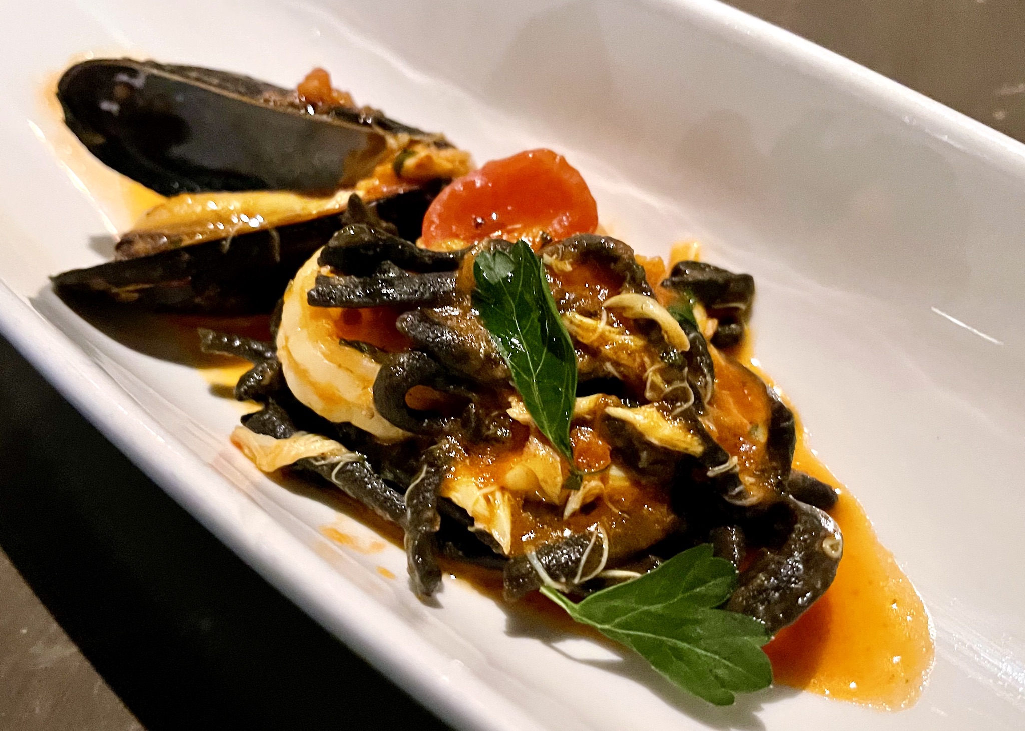 Sea Salt Linguini Nero with squid ink, tomato, mussels, shrimp