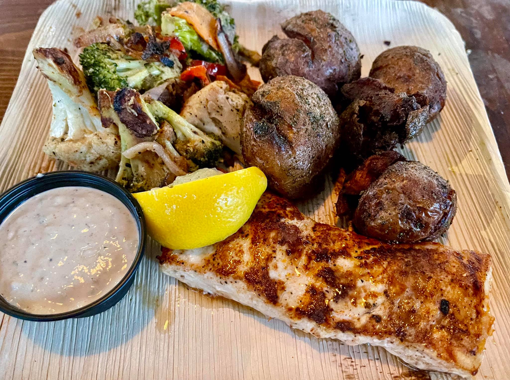 Mahi Mahi Day Boat Fresh Catch dinner blackened with grilled seasonal vegetables and crispy rosemary potatoes with a Cajun remoulade sauce