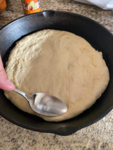 Stretching the pizza dough
