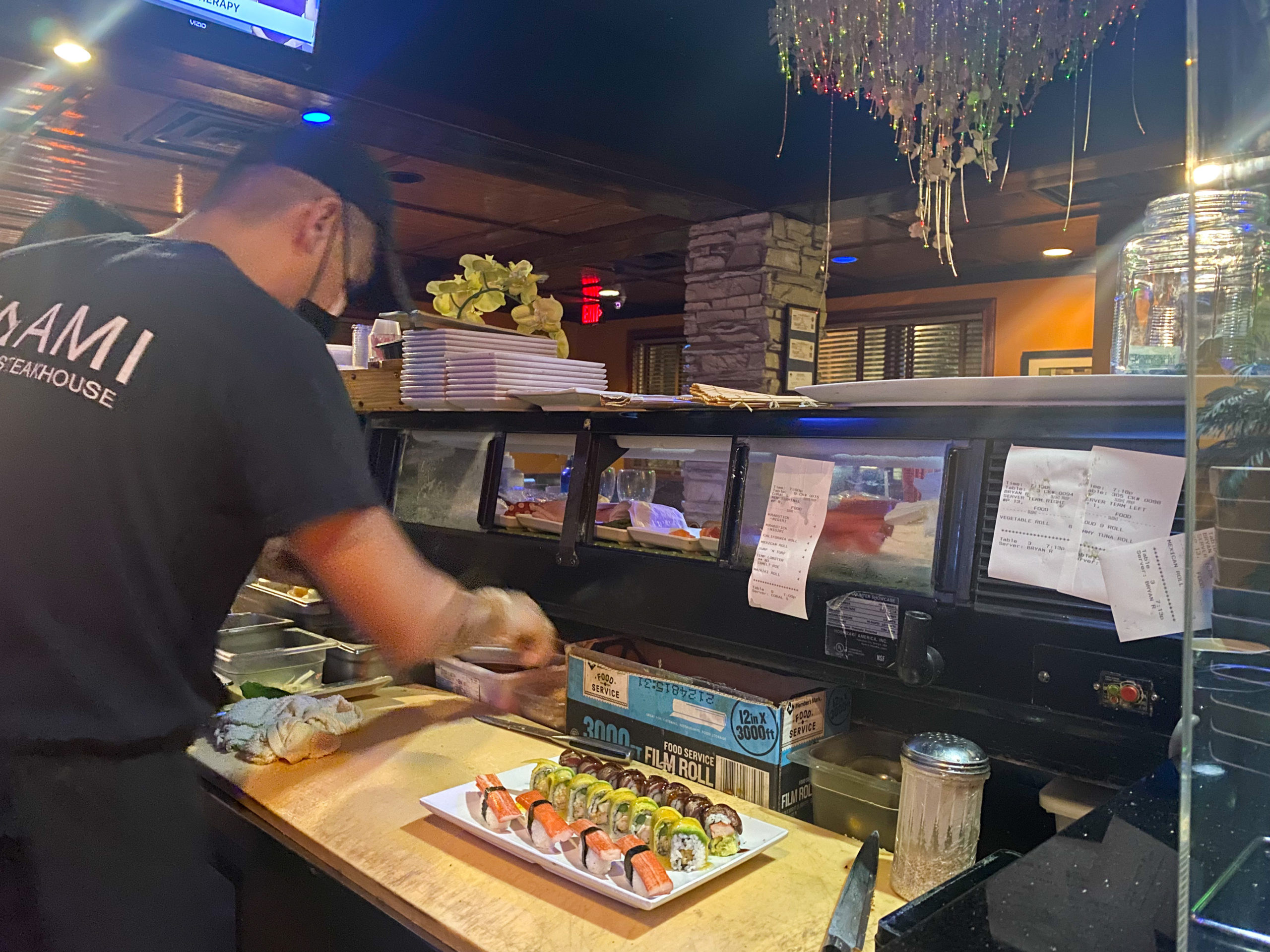 The chef prepairing the sushi