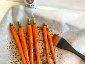 Brushing the carrots with oil and Tamari