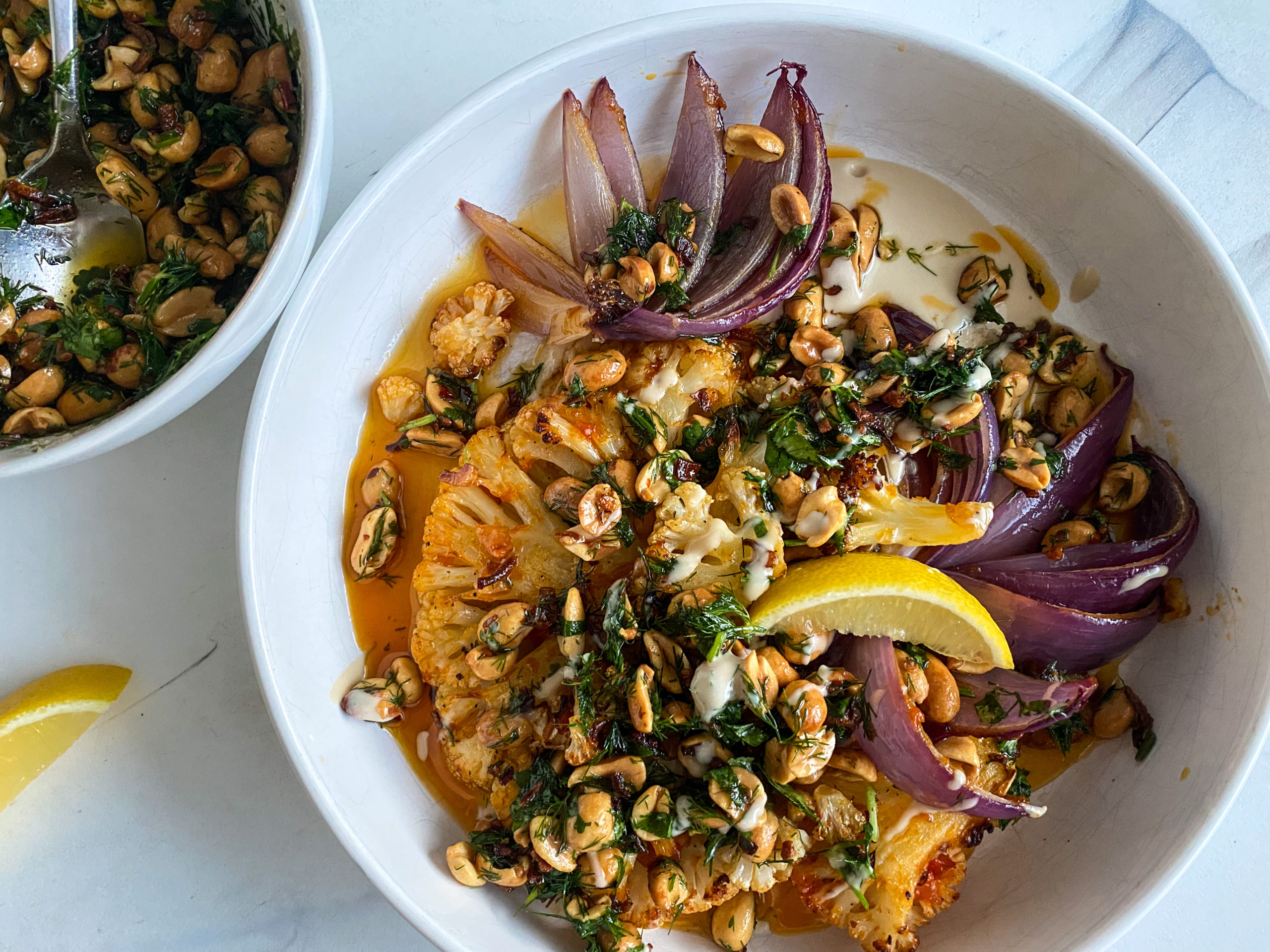 Harissa Cauliflower Steaks with Maple-Tahini and Herby Peanut Crunch