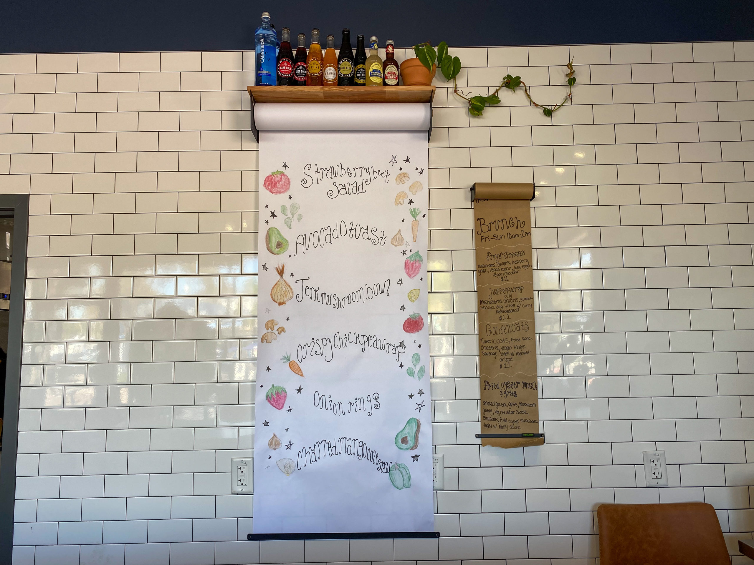 Popular menu & brunch items listed on the back wall behind the counter at Freya's.