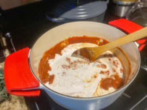 Coconut milk added to the tomatoes