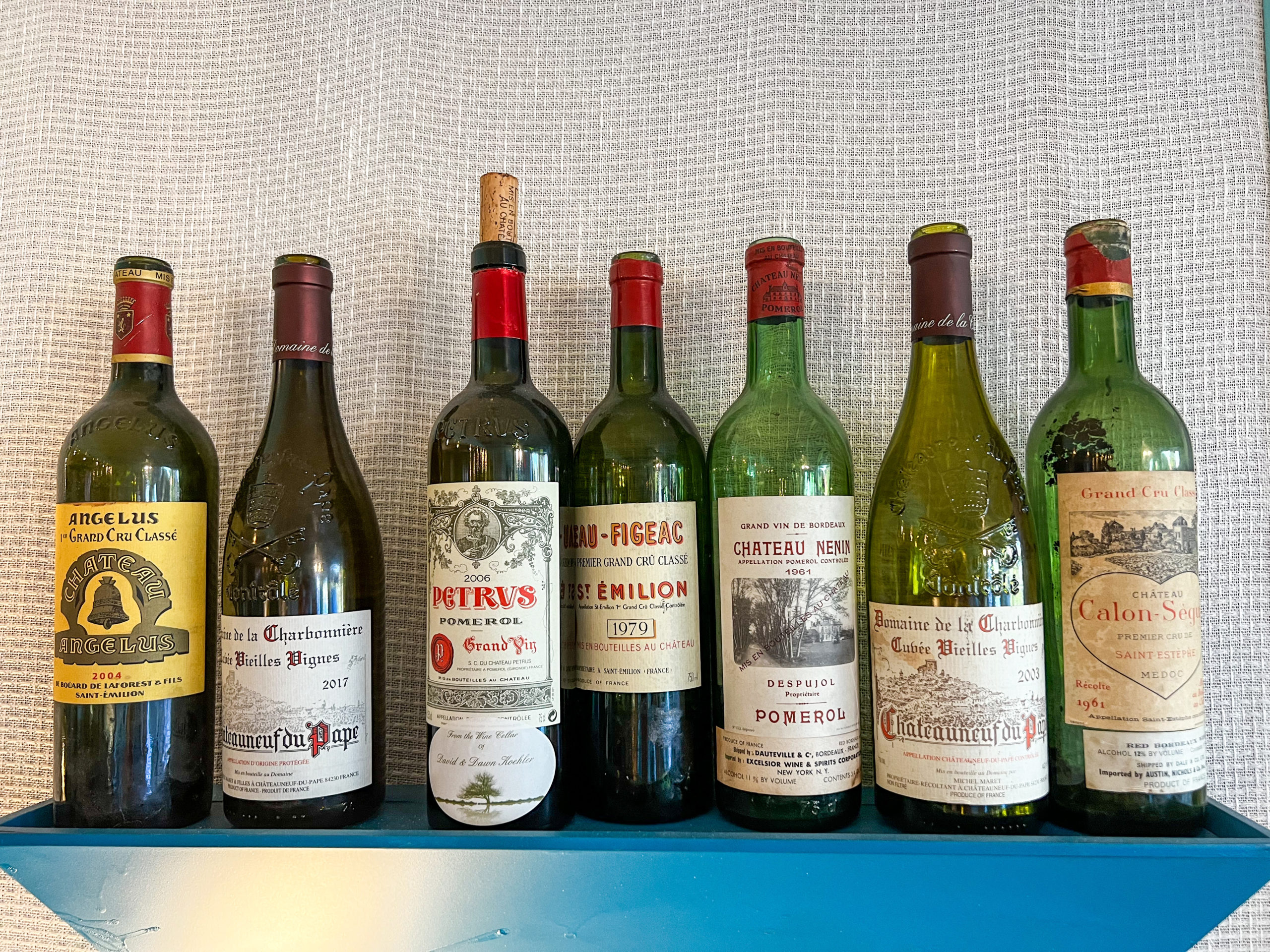 Empty bottles of fabulous wines adorn the walls