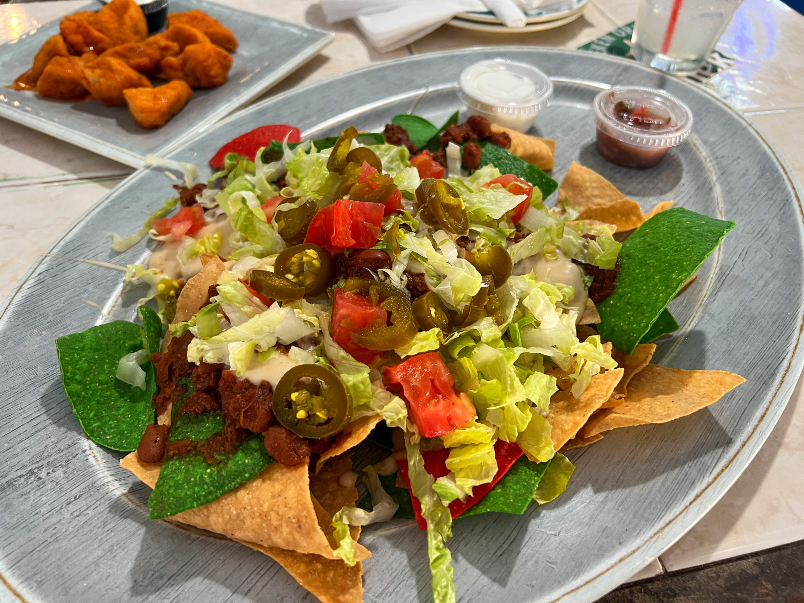 Appetizer nachos loaded with lettuce, tomato, queso, homeamde chili and jalapenos. Served with sour cream and salsa.