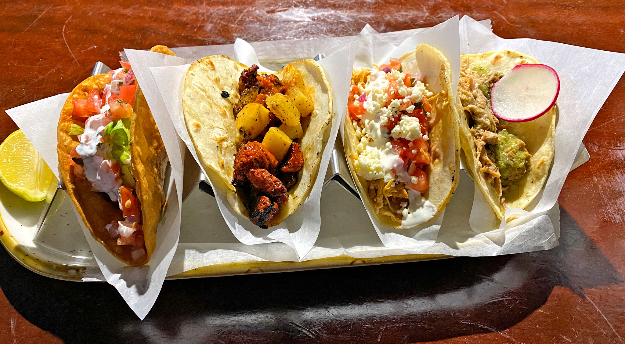 Taco Sampler - 4 Tacos - (R to L) Carnitas, Chicken Tinga, Pastor, and Hard Shell with Ground Beef Picadillo