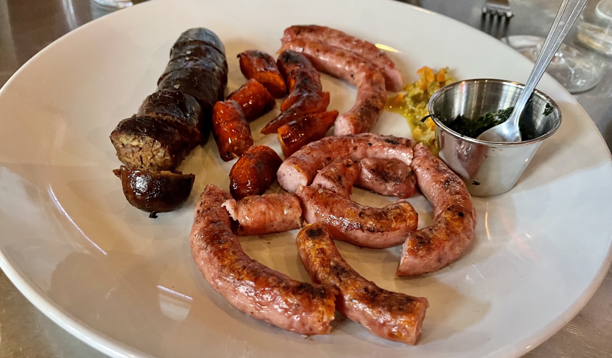 Renzo's Chorizos - house-made sausages: chorizo, picante, grilled salchiche, and morcilla