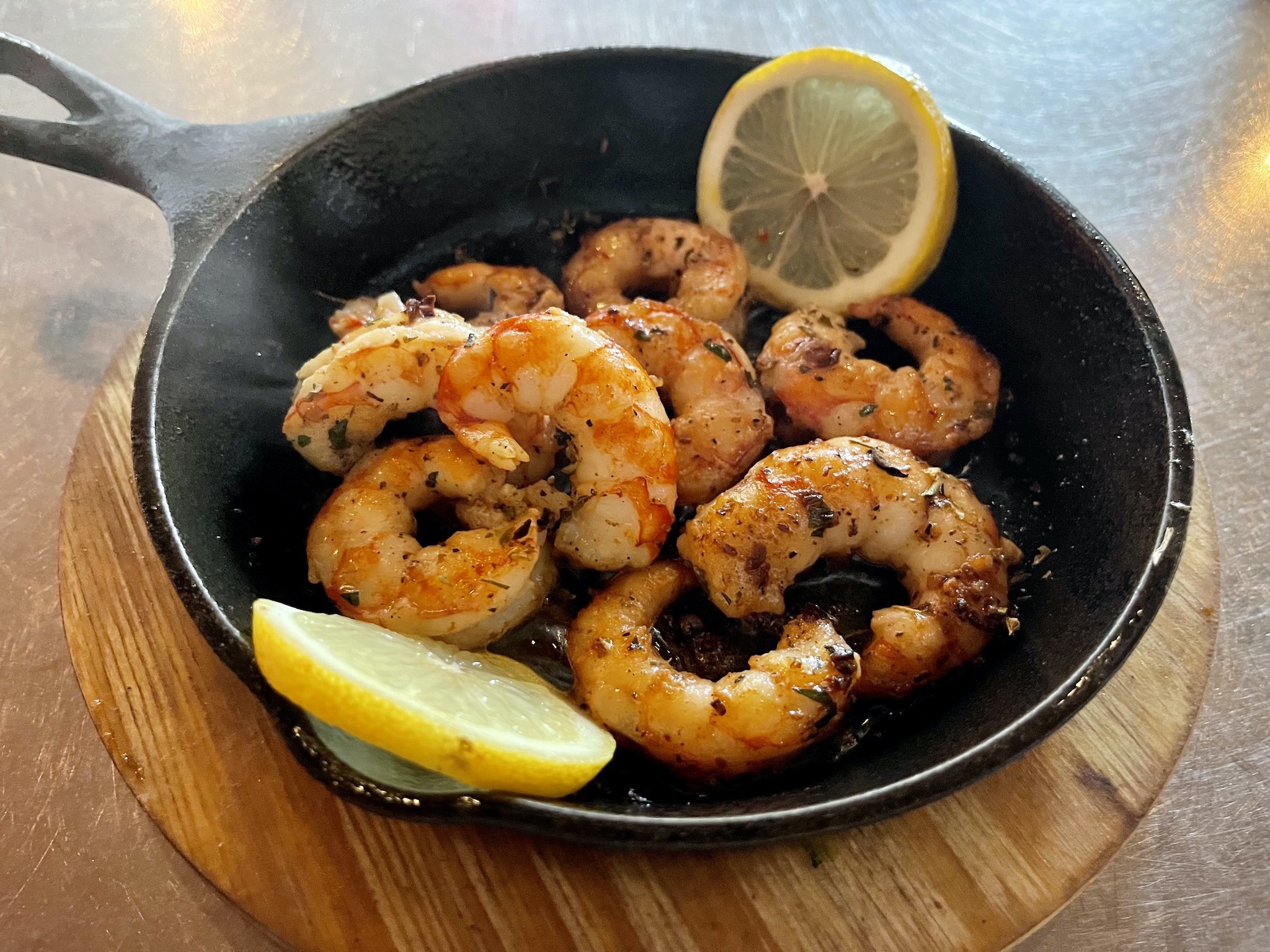 Renzo's Gambas - Argentine jumbo shrimp with garlic butter, fresh herbs, and brandy