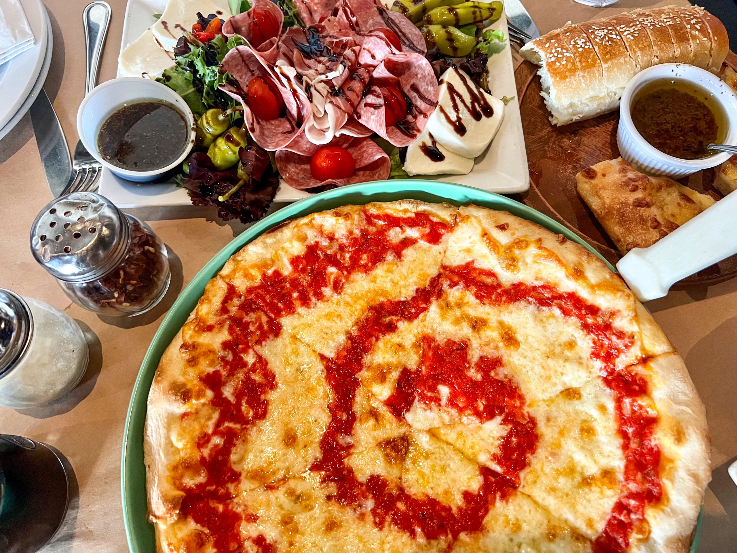 Nonna's Pizza and the Antipasto Salad with bread and olive spread