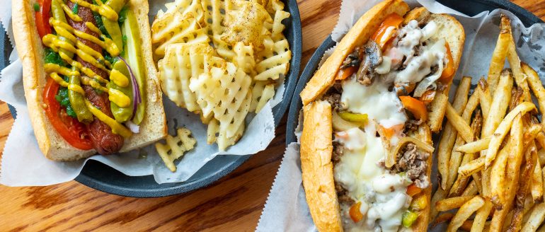 https://stpetersburgfoodies.com/wp-content/uploads/2022/09/The-Burg-Bar-Philly-Steak-Cheese-and-Chicago-Dog-770x328.jpg