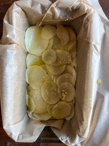 Potatoes layered in the loaf pan