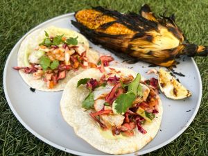 Grilled fish tacos with spicy mango-cabbage slaw