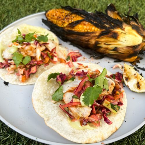 Grilled fish tacos with spicy mango-cabbage slaw