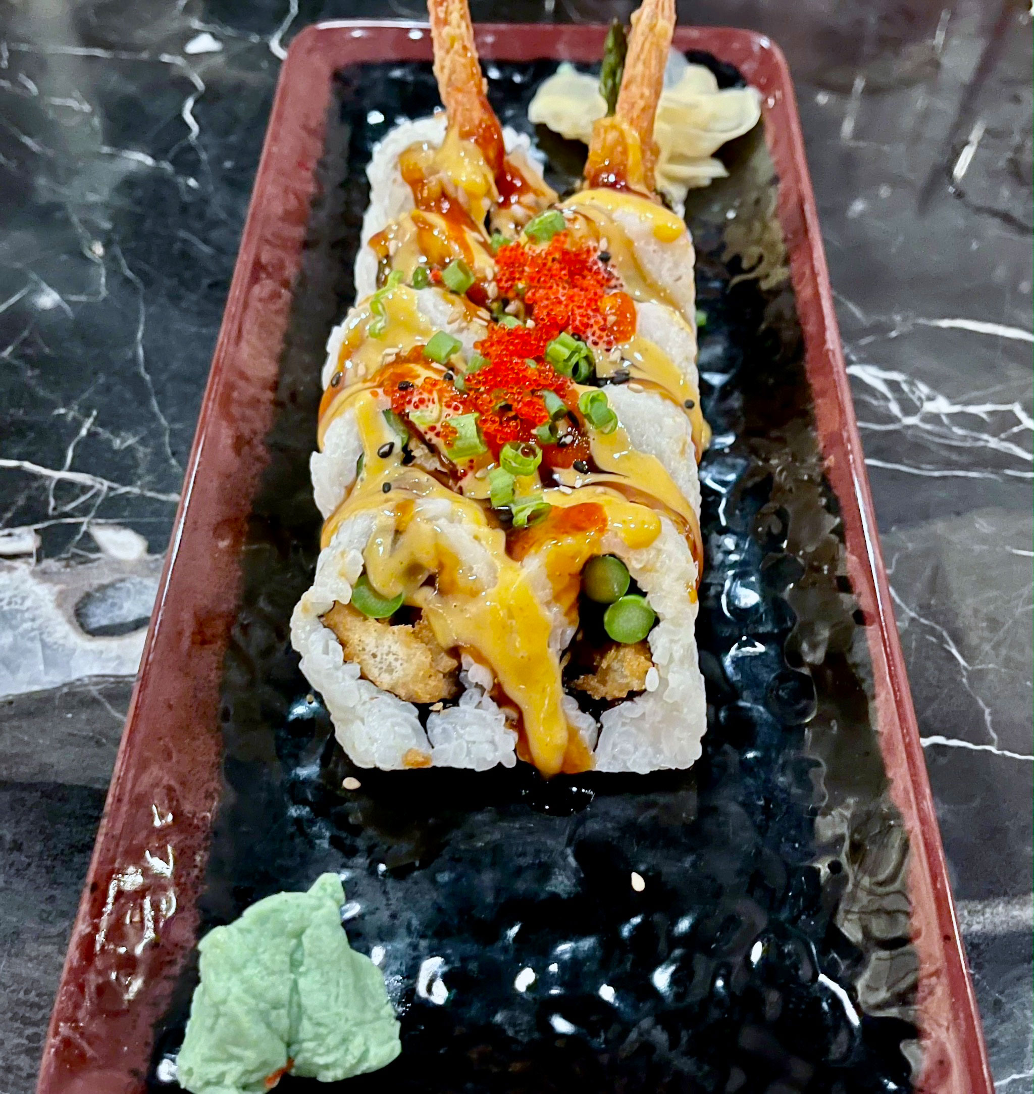 https://stpetersburgfoodies.com/wp-content/uploads/2023/07/Mangosteen-Spider-Roll.jpg