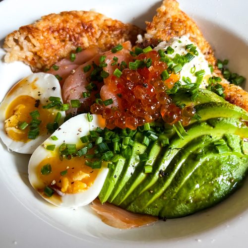 Smoked salmon and crispy rice bowl close up