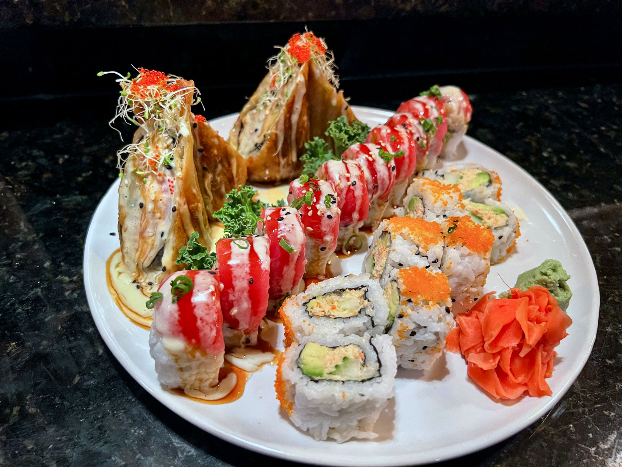 My lunch today! Treated myself to a Lover's roll (tuna, salmon, avocado on  a shrimp tempura and krab roll with eel sauce) and a Crunchy Dragon roll  (tuna and masago over a