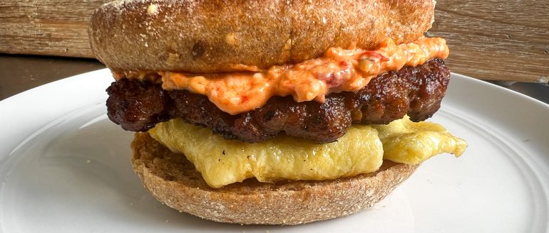 https://stpetersburgfoodies.com/wp-content/uploads/2023/09/Sausage-and-Egg-Breakfast-Sandwich-with-Pimento-Cheese-770x328.jpeg