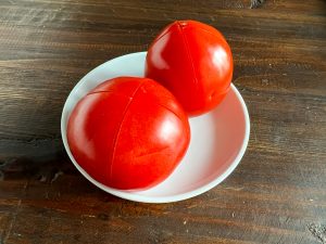 Cut a shallow x into the bottom of the tomatoes before boiling