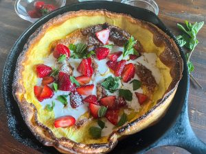 Dutch Baby with Strawberries & Coconut Whip
