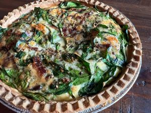 Cook the quiche until it's set and allow to cool for at least 10 minutes before slicing and serving