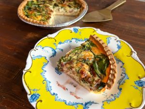 Sliced spinach and bacon quiche