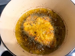 Chicken frying in the oil