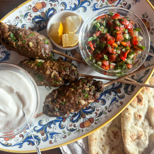 Beef kofta, toum sauce and a cucumber & tomato salad