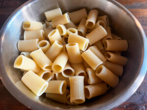 Cooked rigatoni that has been cooled and tossed with olive oil to prevent sticking