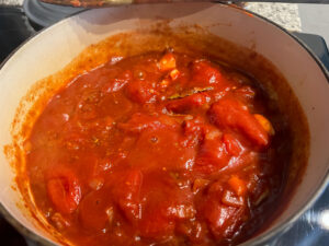 Tomatoes added in and ready to cook down