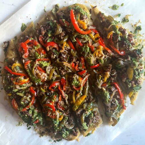 Flatbread topped with savory ground sausage, herbacious pesto and a tangy peperonata